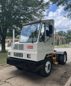Yard Spotter Truck | Renew Truck in New Boston, TX. Image of a white Kalmar yard spotter truck parked in an industrial park.