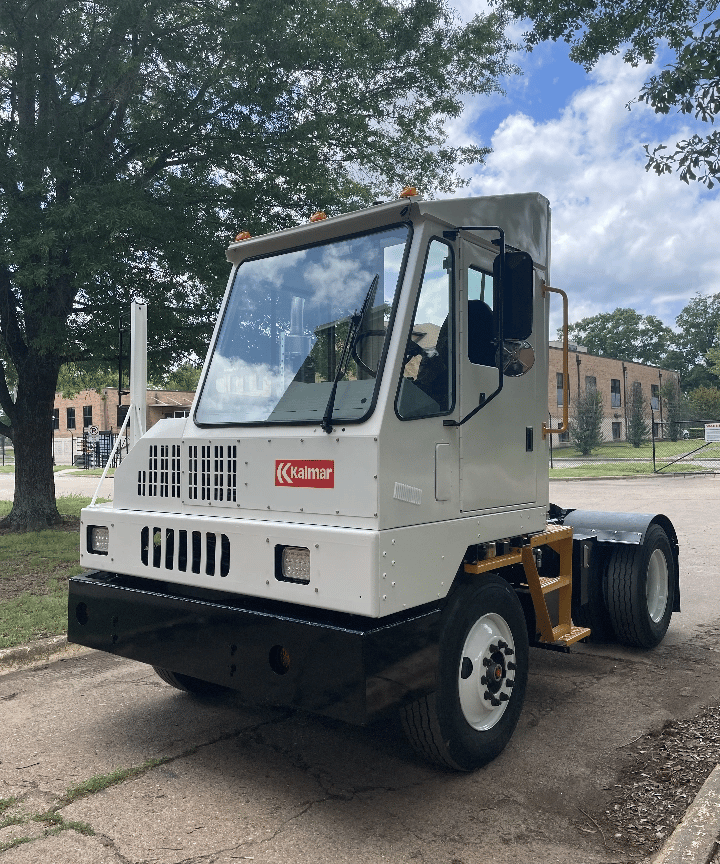 Yard Spotter Truck | Renew Truck in New Boston, TX. Image of a white Kalmar yard spotter truck parked in an industrial park.