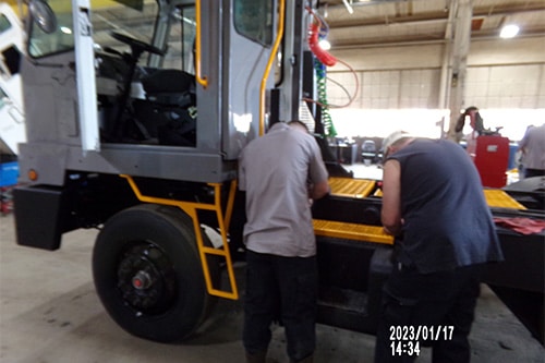 Safety Concerns in Operating Yard Spotter Trucks (and How to Avoid Them) | Renew Truck in Boston, TX. Image of yard truck technicians doing inspection and repairs to ensure yard truck is safe.