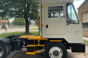 yard truck buying guide, spotter truck repair in New Boston, TX at Renew Truck. Side view of a newly refurbished semi-truck highlighting the clean and updated cabin and steps.