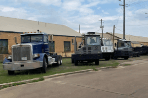 Ottawa yard truck dealer, spotter truck repair in New Boston, TX at Renew Truck. Image of a yard spotter truck and heavy-duty semi parked outside, showcasing the shop’s expertise in rebuilding, servicing, and restoring yard trucks for peak performance.